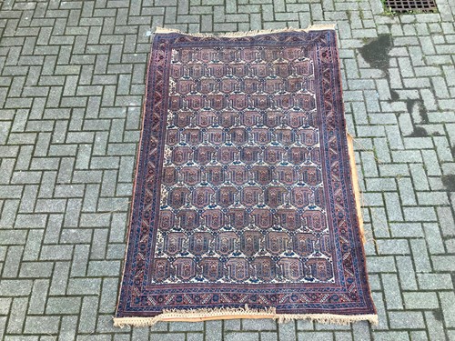 Lot 960 - A Kamseh boteh design tribal rug