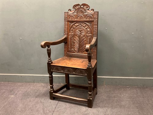 Lot 779 - A 17th century style oak wainscot armchair 126...
