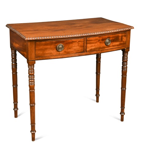 Lot 622 - A late Regency mahogany bow front side table