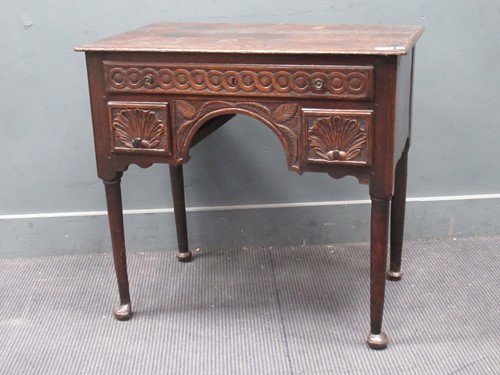 Lot 789 - A George III oak low-boy decorated in the 19th...