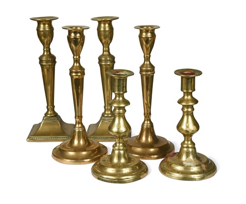 Lot 487 - A collection of three pairs of brass candle sticks, 18th and 19th century