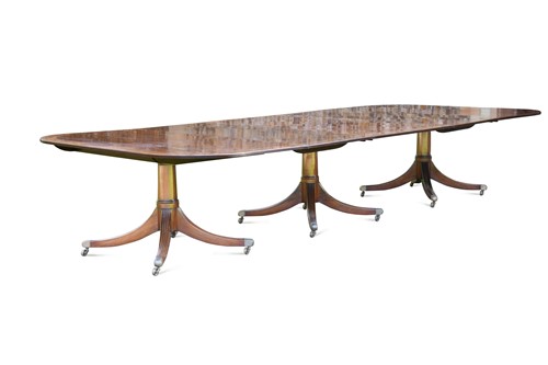 Lot 615 - A Regency style mahogany triple pillar dining table, late 20th century