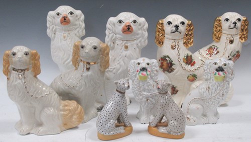 Lot 68 - A collection of Staffordshire type spaniels,...