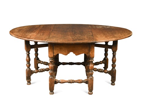 Lot 404 - A large oak double gateleg table, early 18th century style