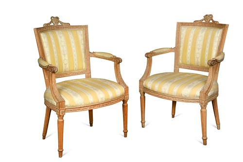 Lot 707 - A pair of Louis XVI style beechwood fauteuils