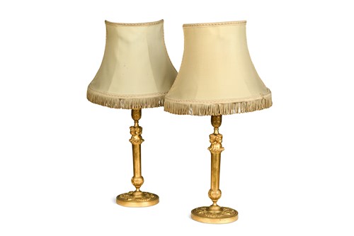 Lot 687 - A pair of gilt bronze candle stick lamps, 19th century
