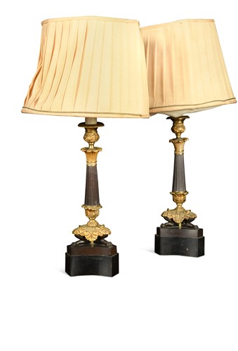Lot 681 - A pair of Regency style bronzed and gilt metal triform candlestick lamps, 20th century