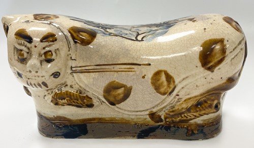 Lot 82 - A Cizhou style ceramic pillow modelled in the form of a leopard