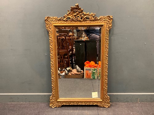 Lot 675 - A late Victorian gilt wood wall mirror, the...