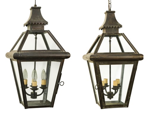 Lot 573 - A pair of four light brass hanging hall lanterns, early 20th century