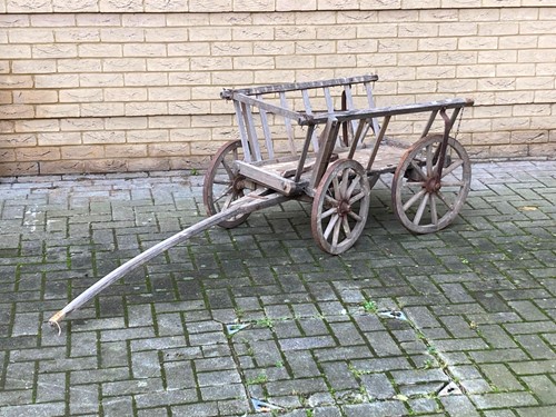 Lot 930 - A 20th century teak dog cart, 62 x 90 x 70cm