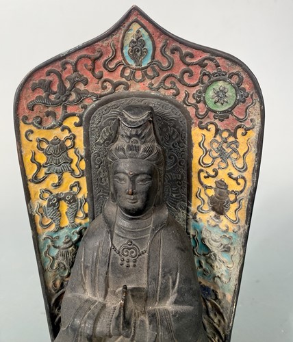 Lot 19 - A Chinese champleve enamel decorated Guanyin,  Qing Dynasty 18/19th century