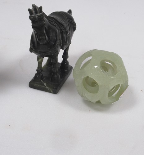 Lot 64 - A jade-type puzzle ball decorated with fish...