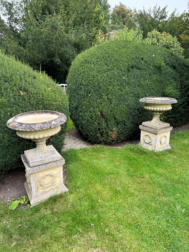 Lot 937 - A pair of sandford stone garden campana style...