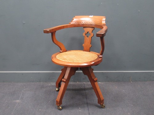 Lot 895 - An Aesthetic period walnut desk chair, with...
