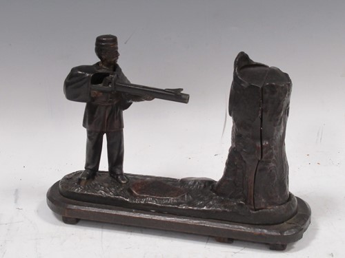 Lot 44 - A figural metal moneybox with mechanic...