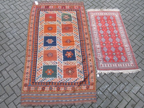 Lot 904 - A Caucasian design rug, 248 x 135cm and...