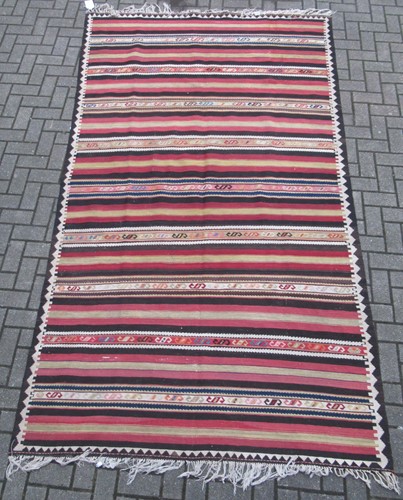 Lot 906 - A Qashqai striped kelim rug, 311 x 177cm