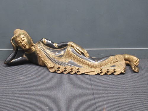 Lot 882 - A carved wooden Buddha retailed by Liberty's...
