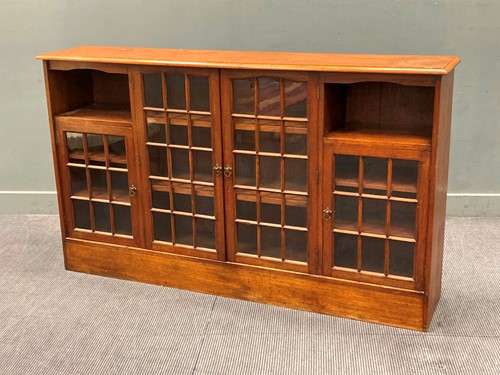 Lot 751 - A late Victorian walnut panel glazed four door...
