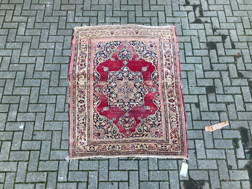 Lot 955 - A Red ground Persian-style rug, possibly...