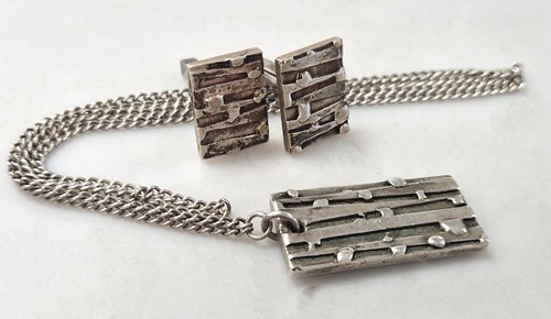 Lot 329 - A pair of cufflinks and pendant by Brian...
