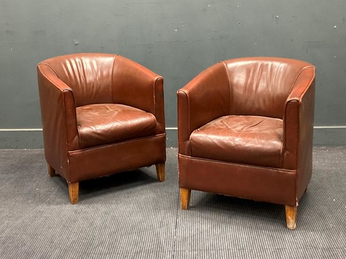 Lot 883 - A pair of Art Deco style brown leather tub...