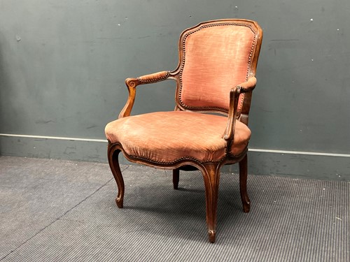 Lot 847 - A French walnut Louis XV style fauteuil...