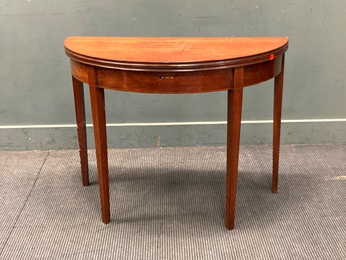 Lot 762 - A 19th century mahogany tea table with fold...