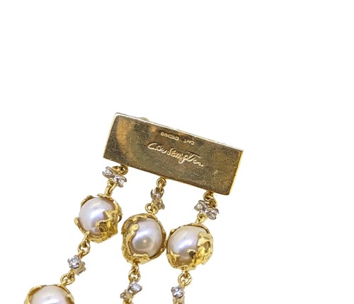 Lot 289 - Charles de Temple - A pearl and diamond 'Wrapped' bracelet, together with a matching single earring