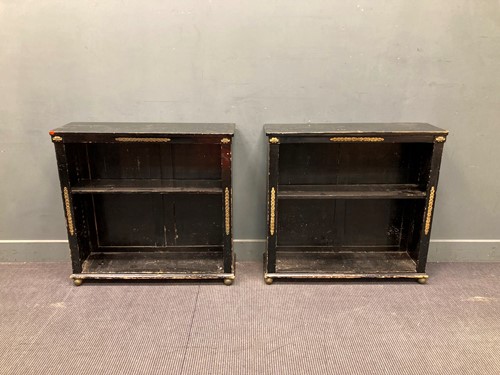 Lot 683 - A pair of Regency style ebonised open...