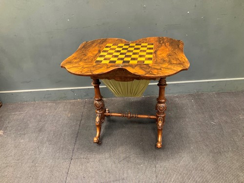Lot 806 - A Victorian walnut games and work table with...