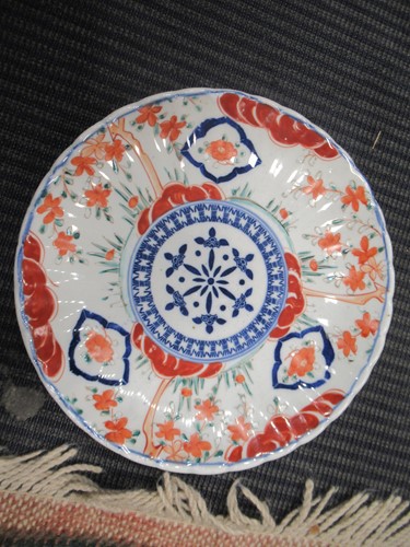 Lot 165 - A pair of Japanese Imari plates; together with...