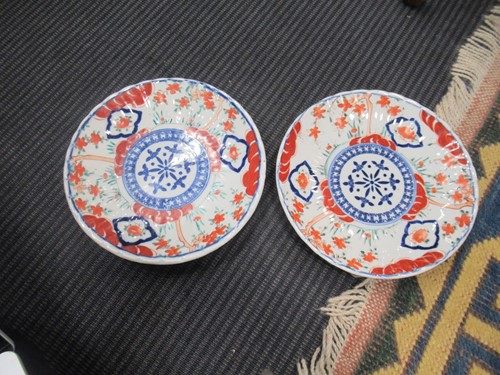 Lot 165 - A pair of Japanese Imari plates; together with...