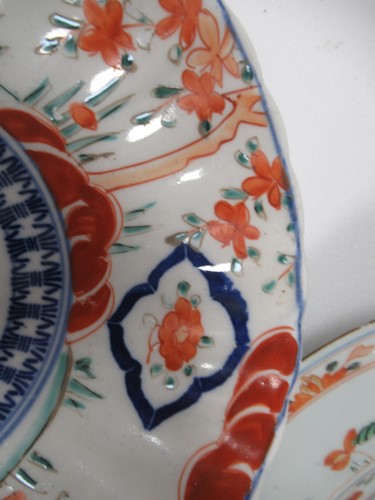Lot 165 - A pair of Japanese Imari plates; together with...