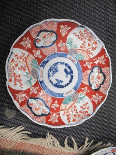 Lot 165 - A pair of Japanese Imari plates; together with...