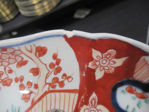 Lot 165 - A pair of Japanese Imari plates; together with...