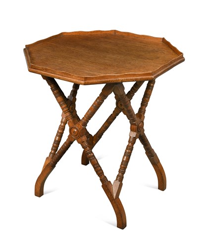 Lot 202 - An Aesthetic period oak occasional table