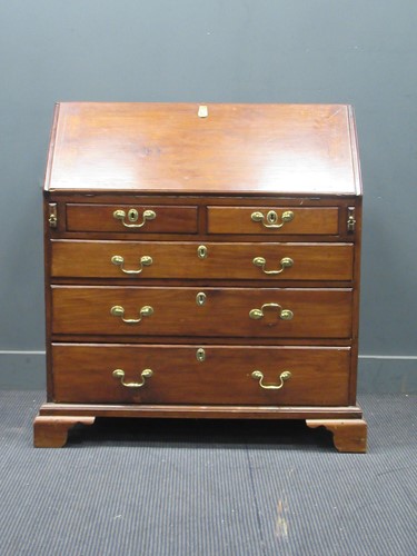 Lot 836 - A George III mahogany bureau, of typical form...