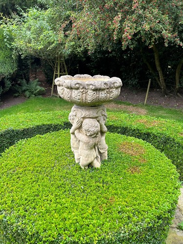 Lot 943 - A late 20th century composite birdbath a leaf...