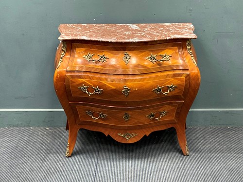 Lot 848 - A Louis XV style marble topped bombe commode...