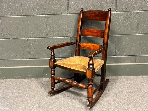Lot 751 - A childs rocking chair, 74 x 43 x 51cm