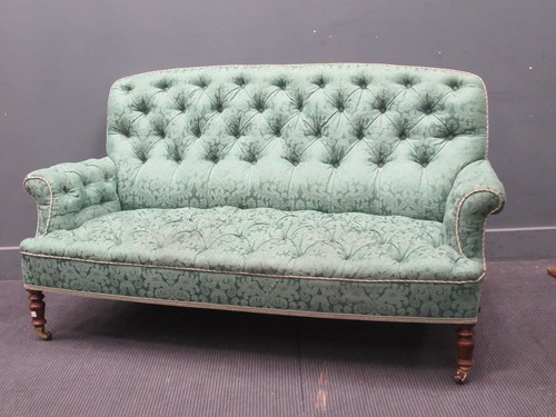 Lot 810 - A late Victorian button back sofa on turned...