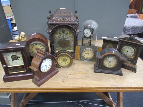 Lot 161 - A 19th century carved mantle clock; together...