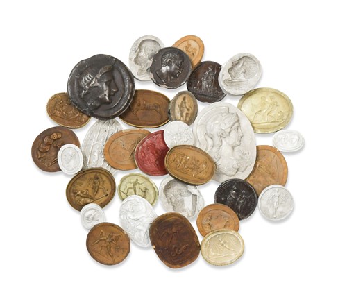 Lot 692 - A collection of 'Grand Tour' plaster relief cameos and medallions, 19th century