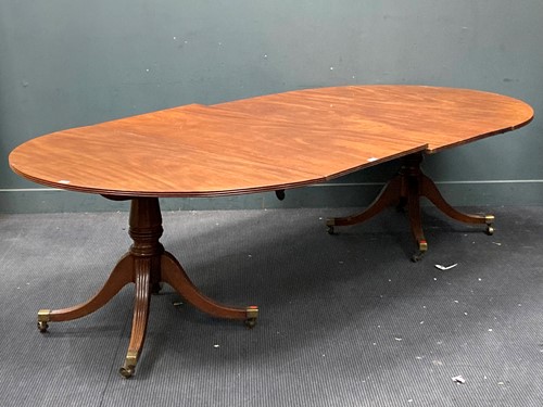 Lot 917 - A Regency and later mahogany D-end dining...