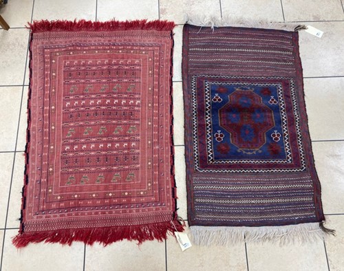 Lot 970 - A red ground tribal rug, with geometric design...