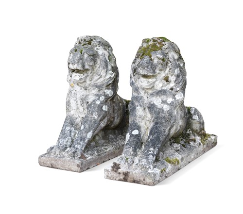 Lot 846 - A pair of weathered reconstituted stone lions, 20th century