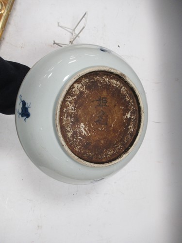 Lot 13 - A Chinese Kangxi-style blue and white shallow...