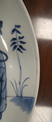 Lot 13 - A Chinese Kangxi-style blue and white shallow...